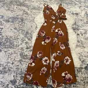 Women’s Romper.Spaghetti strap with left side belt.Size XS.Color Brown (floral)